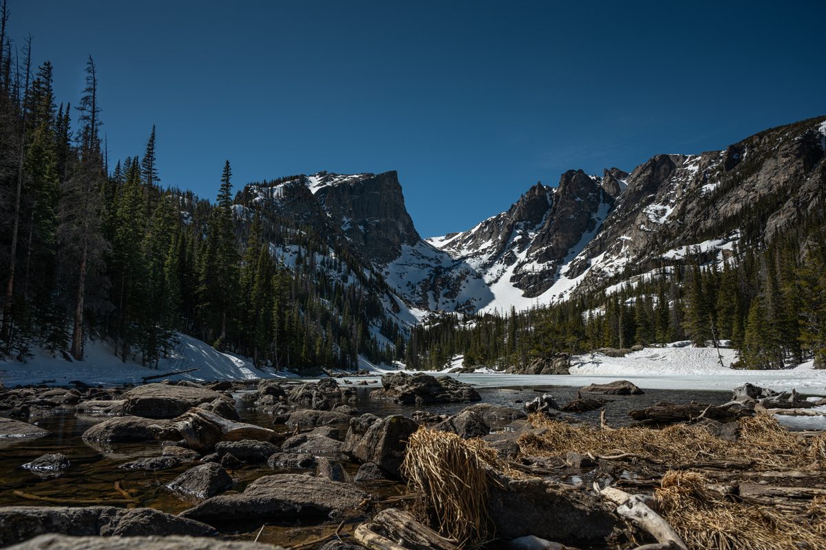 Hallett Peak above a thawing Dream Lake — Rocky Mountain, Colorado