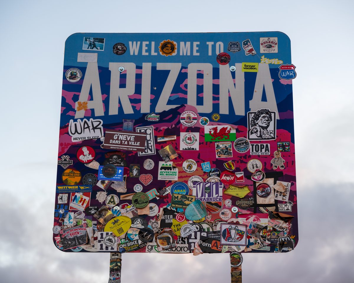 A decade of stickers on the Arizona sign — The Colorado Plateau, Utah & Arizona